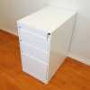 White metal three drawer (box-box-file) pedestal drawers.